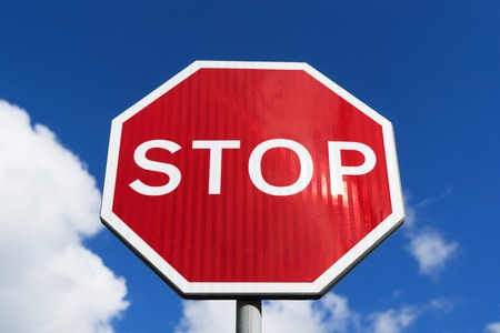 Stop sign blue sky background. street signs.