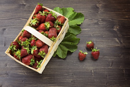 Wicker basket with juicy fresh strawberriesの写真素材