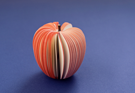 Fake Apple from paper on the purple violet background. Office notes diet concept, close up, soft focusの写真素材