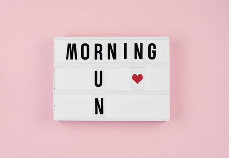 Minimalistic concept of healthy lifestyles and physical activity. Motivation quotes on light box on...