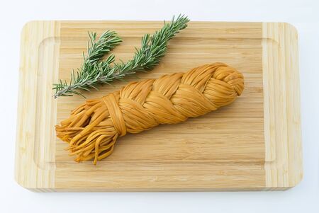 Armenian chechil smoked cheese on the wooden backgroundの写真素材