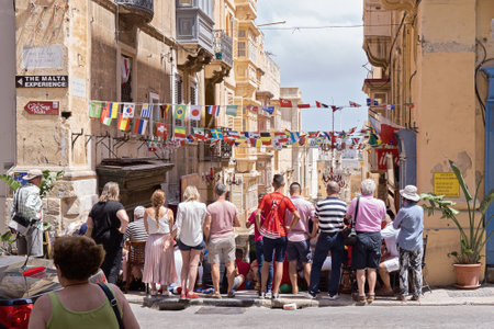VALLETTA, MALTA - JUNE 24, 2018: Maltese people fans watch football match on Valletta street in capital of Malta in sports pub outsideのeditorial素材