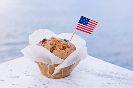 Miniature flag of America USA with sweet cupcake. Greeting card for celebration of President's Day in America concept, Independence dayの写真素材