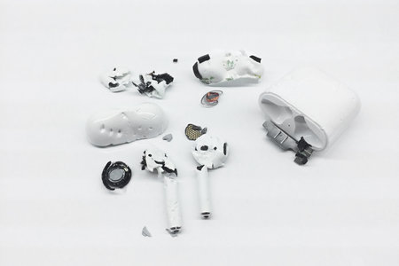 Bitten and Chewed by dog teeth AirPods Wireless Headphones by Apple. Pet Chewing problem concept....