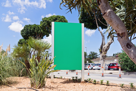 Urban modern city billboard outdoor advertising in Malta against Sky blue background. Advertisement concept. Billboard, poster, banner.の写真素材