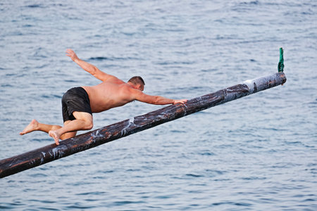 Xghajra, Malta - August 3, 2019: Traditional Maltese game of Gostra, where is Brave local men would...