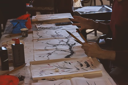 Master gives Chinese Ink Painting lesson, workshop in Chinese Garden of Serenity during celebration of Chinese New Year in Malta: Santa Lucija, Malta - January 19, 2020のeditorial素材