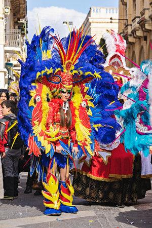 People in makeup and carnival costumes during Fat Tuesday at Mardi Gras carnival in Valletta, Maltaのeditorial素材