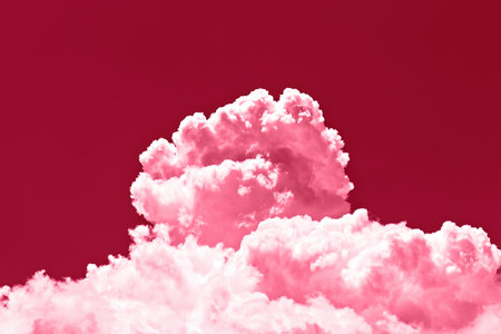 Large cumulus cloud on clear pink sky. Concept of environmental pollution. Image toned in color of the year 2023 viva magentaの写真素材