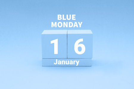 Blue Monday in January, saddest Monday of the year. Wooden calendar with text January 16の写真素材