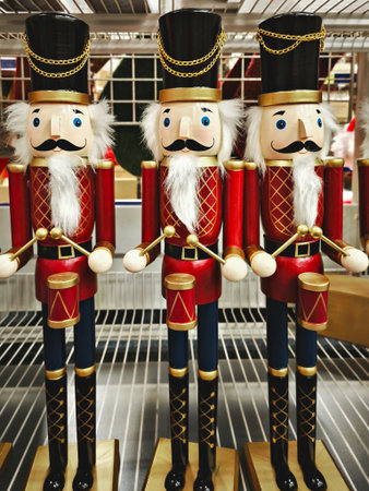 Traditional wooden red and gold nutcracker guards in uniform, bright festive holiday vibe