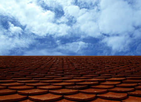 Classic tile roof against blue sky