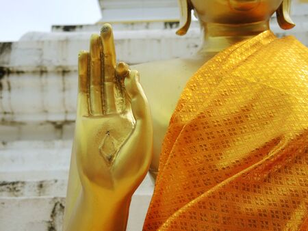 The raised palm of a Buddha Statueの写真素材