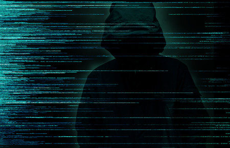 Hacker over a screen with digital code interface around. Internet crime conceptの写真素材