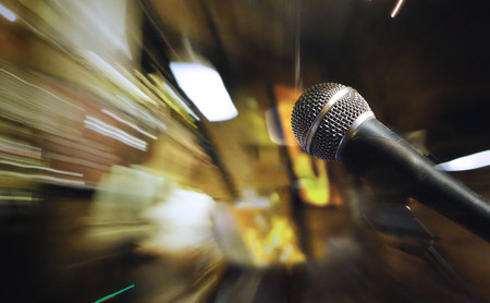 Microphone on stage for sound, music, concert entertainment background.の写真素材