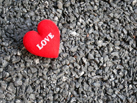 Valentines day red heart on stone background. Holidays card with copy space.の写真素材