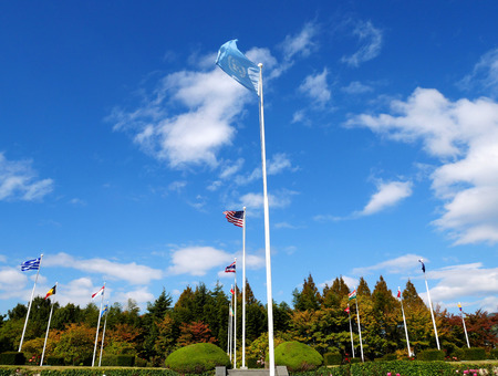The United Nations cemetery in Busan, South Korea with the flags of the UN countries that...