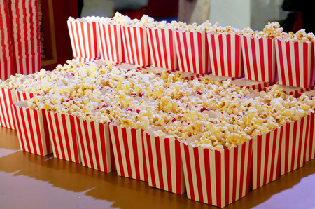 Popcorn in red and white cardboard box ready for the movies.の写真素材