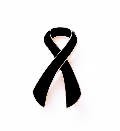 Black ribbon. Melanoma awareness. Mourning symbol.の写真素材