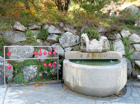 Holy spring water with dipper for drink at Seokguram Grotto Temple Gyeongju, South Korea.のeditorial素材