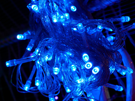 Glowing blue lights bulbs design illumination, celebration, decoration concept.の写真素材