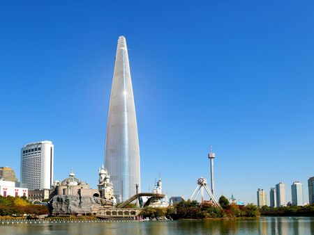 Seoul, South Korea - October 30, 2017: Seoul sky tower and Lotte World amusement park around Seokchon lake with clear blue sky, a major tourist attraction in Seoul, South Korea.のeditorial素材