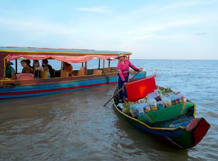 Siem Reap, Cambodia - August 11, 2017 : A Cambodian woman boating for sale to tourists on the Tonle Sap lake in Cambodia.のeditorial素材