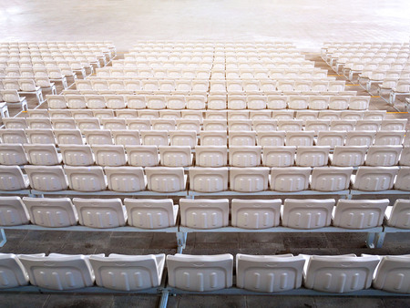 Empty stadium seats in row viewed from behind.の写真素材