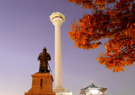 Busan tower and statue of admiral yi sun-sin in yongdusan park at night in Korea.のeditorial素材