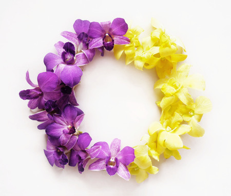 Round frame wreath made of orchid flowers. Flat lay. Nature background.の写真素材