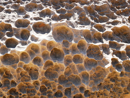 Honeycomb weathering surface of rock in Yehliu Geopark, New Taipei, Taiwanの写真素材