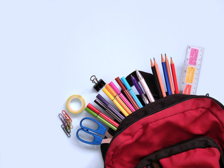 Back to school background with school supplies in school backpack.の写真素材