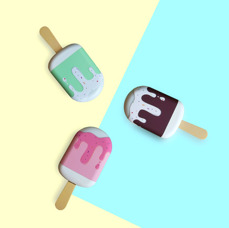 Ice cream stick on yellow and blue background.の写真素材