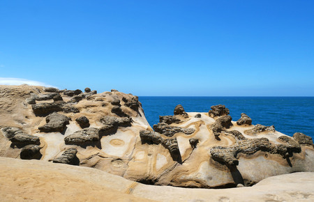 Ginger rock landscape in Yehliu Geopark, New Taipei, Taiwan. The interlacing patterns as shown on the surface of ginger rock are the result of crust extrusion occurred underground.の写真素材