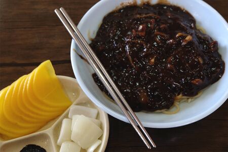 Jajangmyeon, Korean traditional noodles with black bean paste sauce and korean pickle side dishesの写真素材