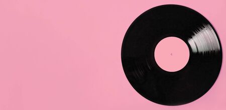 LP record vinyl disc with copy space on pink background. Vintage love songs concept.の写真素材