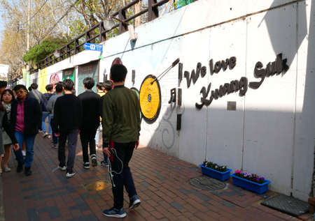 Daegu, South Korea - April 5 2019 : Tourist visit at Kim Kwang Seok Memorial Street. It is a street to commemorate the singer Kim Kwang Seok. It is a tourist attraction in Daegu, South Korea.のeditorial素材