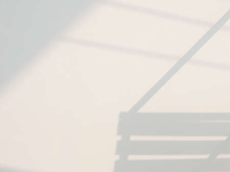 Abstract background with window shadow light on a beige wallの写真素材