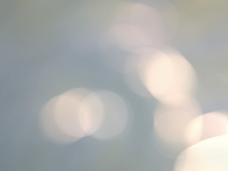 Abstract golden lights bokeh glowing background for designの写真素材