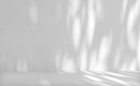 Gray cement wall texture background for product presentation with light and shadow.の写真素材