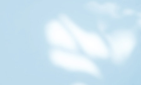 Abstract blue background with light and shadow from the window on wall.の写真素材
