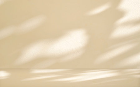 Abstract beige background for product presentation with light and shadow from the window on wall.の写真素材