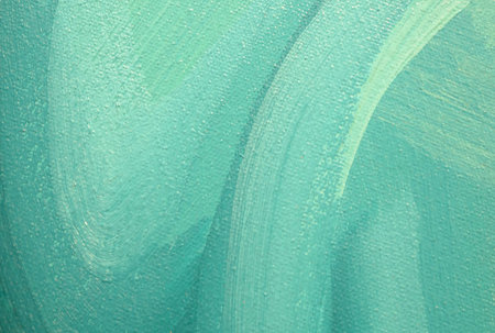 Abstract background of green paints with brush strokes on canvas textureの写真素材