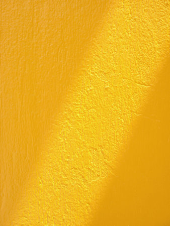Abstract diagonal shadow overlay on yellow concrete wall texture background, overlay effect for photo, mock up, product, wall art, design presentationの写真素材