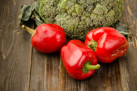 Sweet pepper and broccoli on wooden backgroundの写真素材