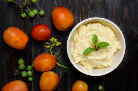 Mashed potato in the bowl on wooden backgroundの写真素材