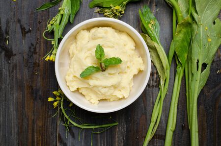 Mashed potato in the bowl on wooden backgroundの写真素材