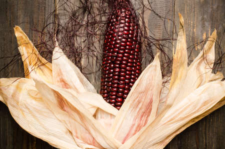 Purple corn on wooden backgroundの写真素材
