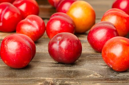 Fresh plum (Julee) on wooden background,healthy foodの写真素材