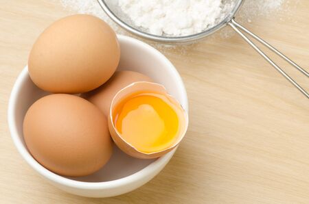 Food ingredient (Egg yolk) for backing (cake,dessert,sweet) on wooden background